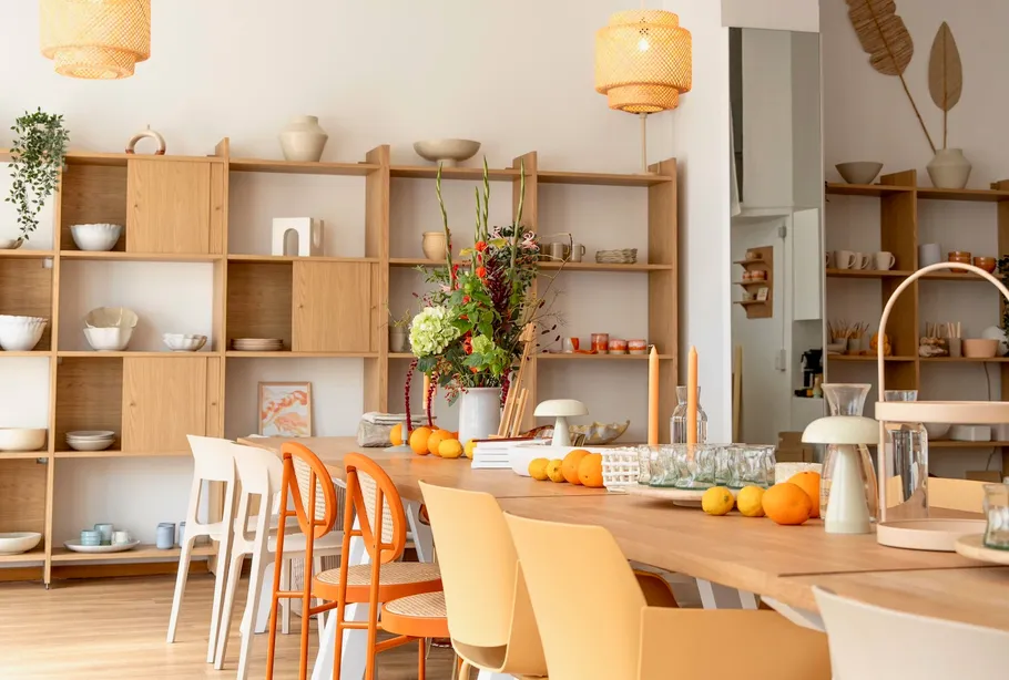 Wooden dining area with shelves and decorations.