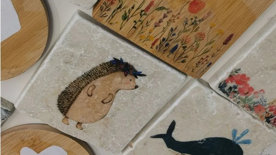 Decorative tiles with animal and floral designs.