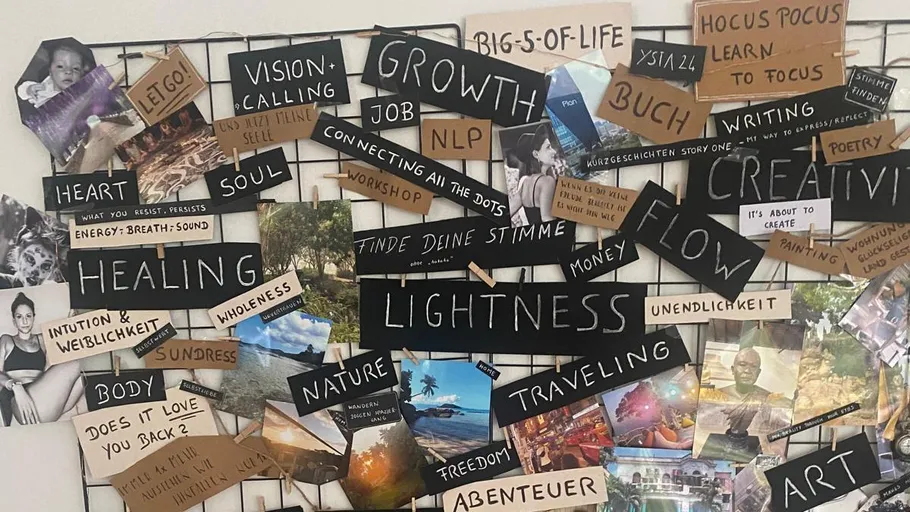 Vision board with motivational texts and images.