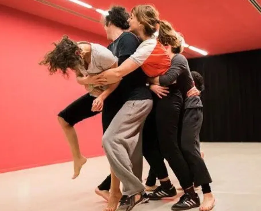 Five people in a group dance rehearsal.