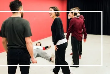 Group of people interacting in a studio.