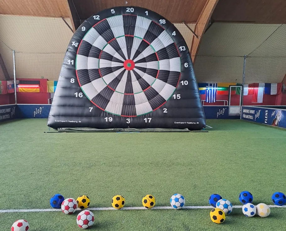 Giant inflatable dartboard for soccer balls indoors.