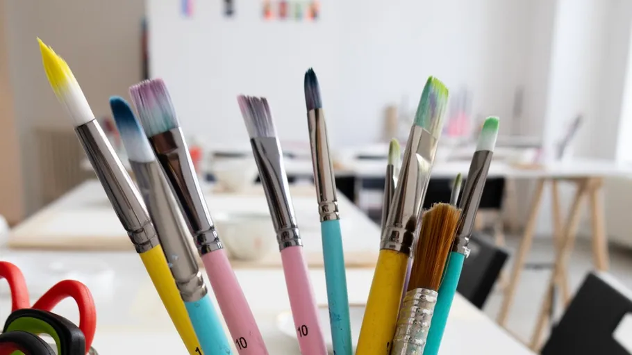 Colorful paintbrushes in an art studio.