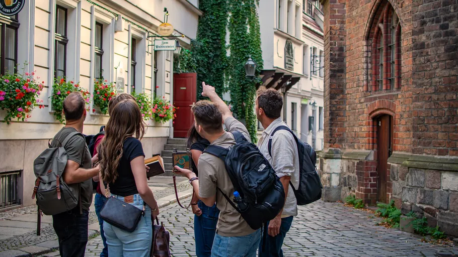 Group of people looking at a historic building.