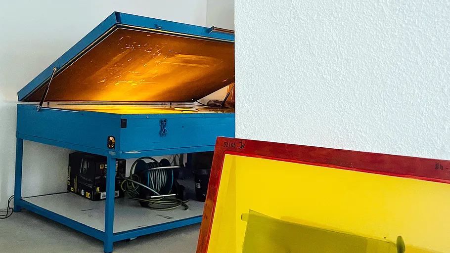 Open blue exposure unit in a workshop.