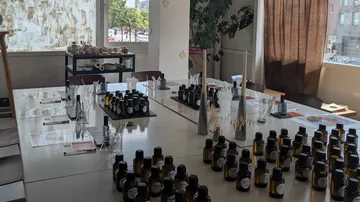 Bottles arranged on tables in a workshop.