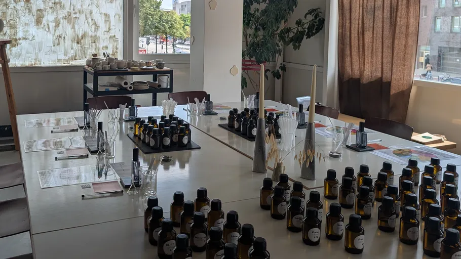 Bottles arranged on tables in a workshop.