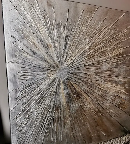 Textured painting with radial lines on canvas.