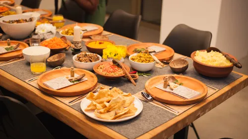 Table with assorted dishes and cutlery.