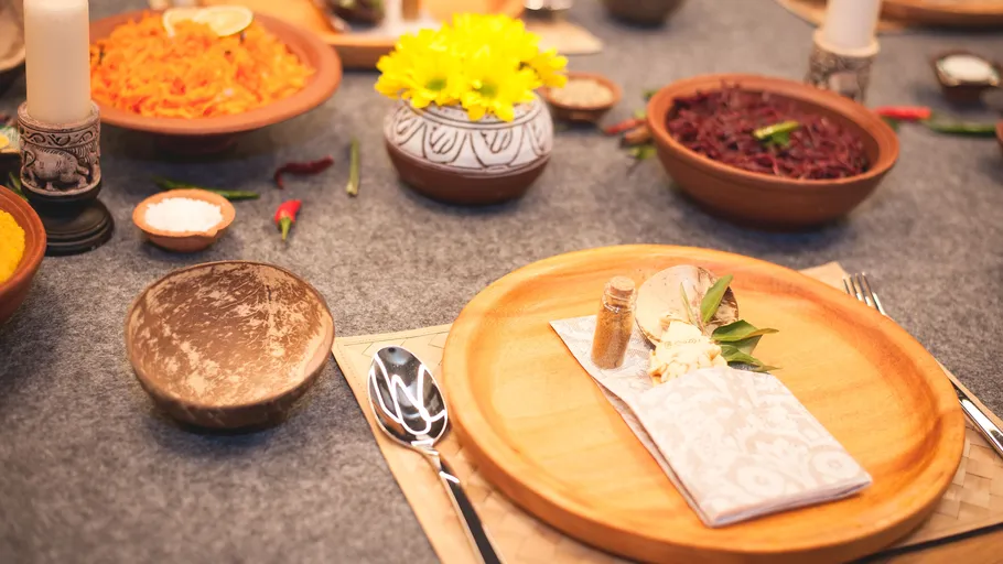 Table with wooden plates and dishes.