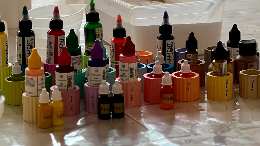 Colorful bottles arranged on a tiled floor.