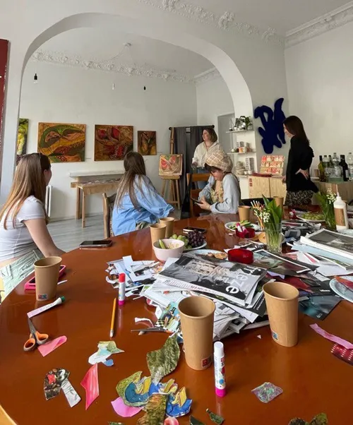 Group creating art projects in studio setting.