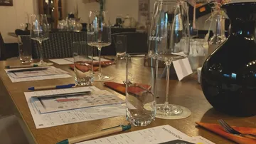 Table set for wine tasting in restaurant.