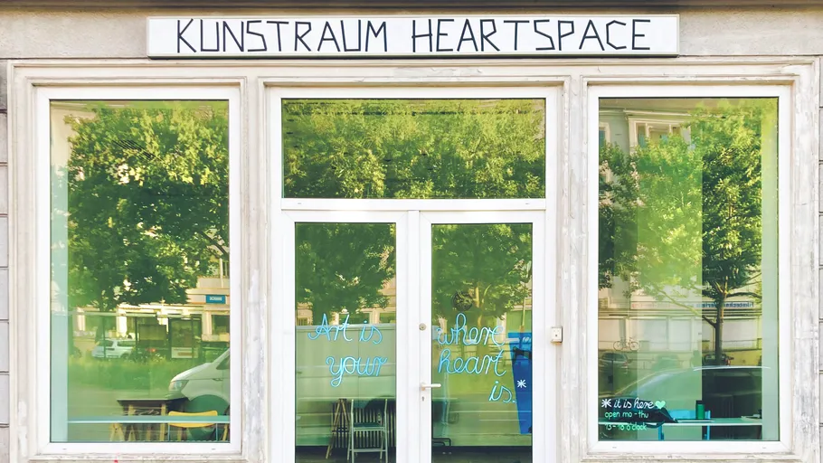 Art gallery exterior with glass door.