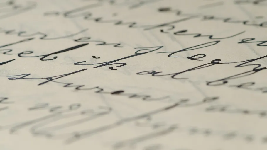 Close-up of handwritten cursive on paper.