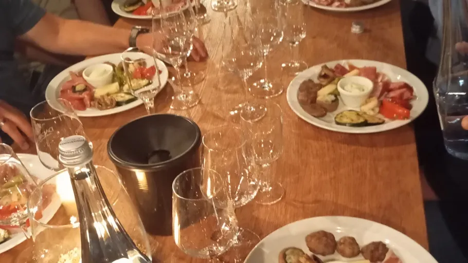 Dinner table with plates and glasses.