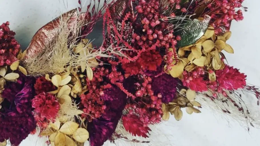 Vibrant dried flowers arranged in a wreath.