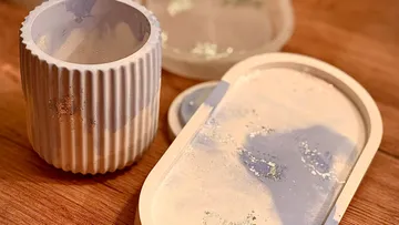 Ceramic tray and cup on wooden table.