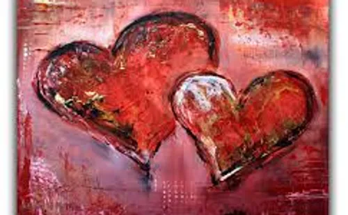 Two painted red hearts on abstract background.