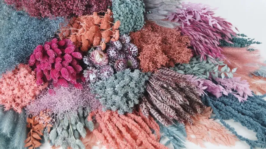 Colorful dried flowers arranged in a pile.