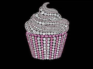 Cupcake made of rhinestones on black background.