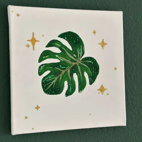 Canvas with green leaf and gold stars.