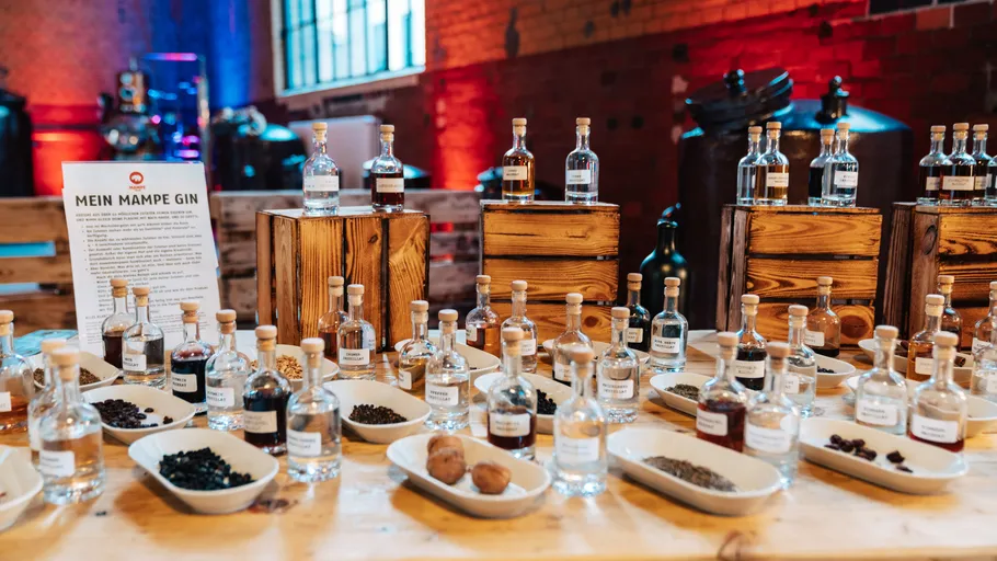 Bottles and ingredients displayed on a table.