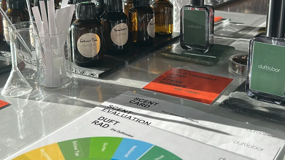 Scent lab with fragrance bottles and evaluation cards.
