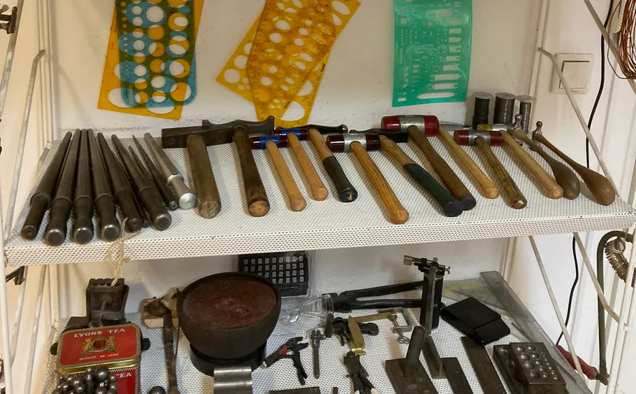 Shelf with tools and stencils.