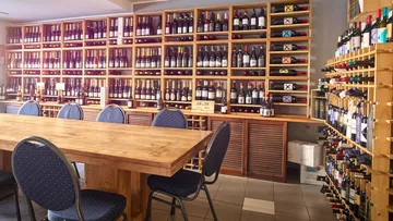 Wine bottles on shelves in a store.