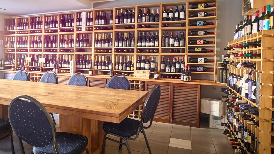Wine bottles on shelves in a store.