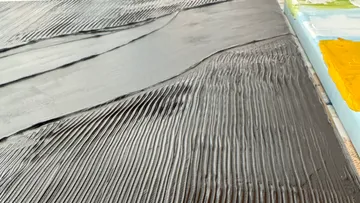 Close-up of textured paint or plaster surface.