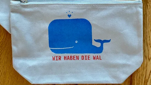 Blue whale print on canvas bag.