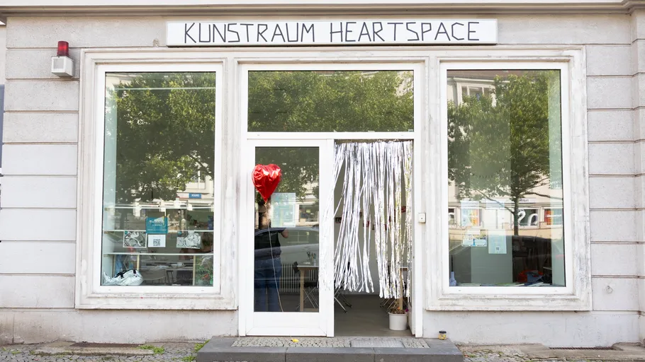 Art space entrance with red balloon outside.
