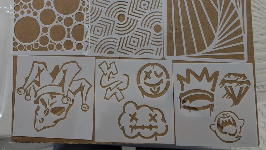 Various intricate stencil patterns on a table.