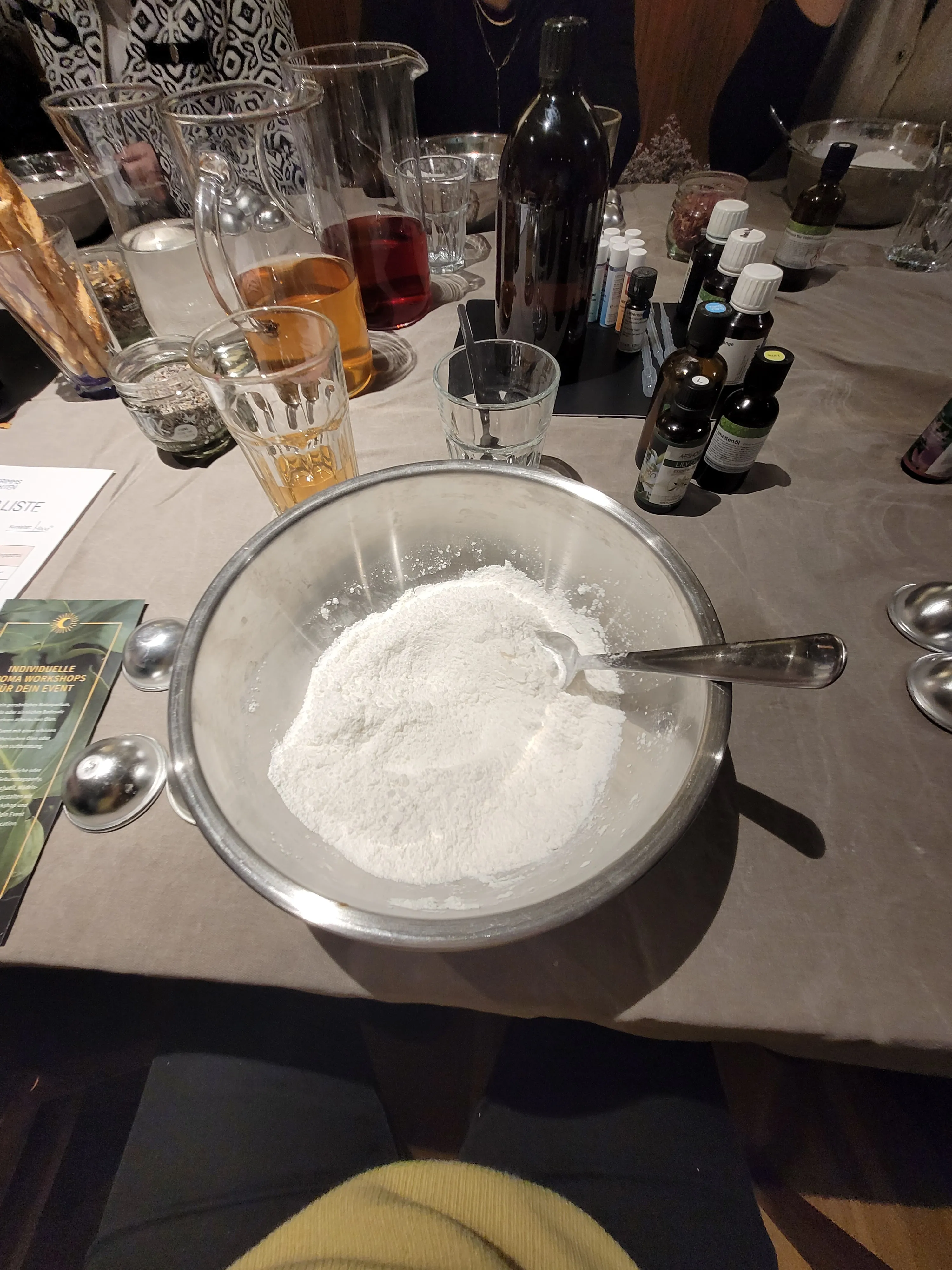 Ingredients and bottles arranged on a table.