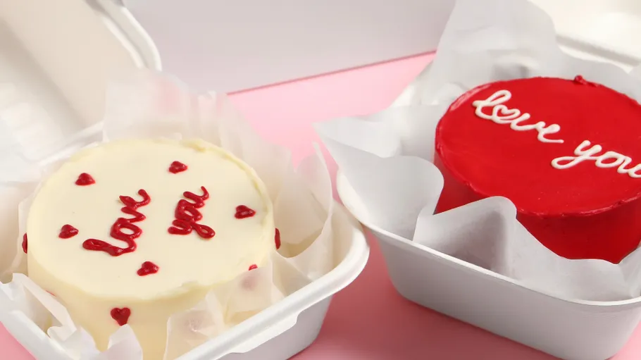 Two cakes with 'love you' in boxes.