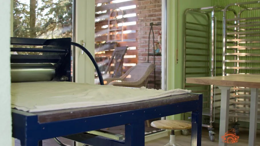 Printmaking press in a bright studio.
