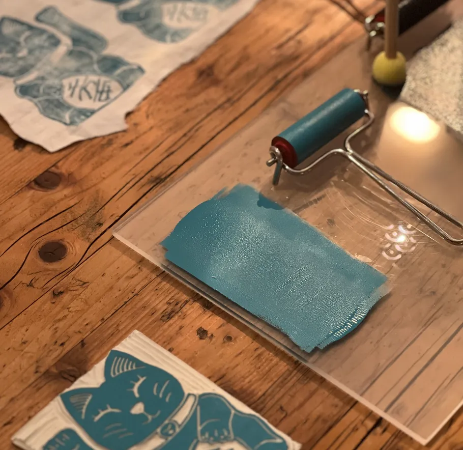 Printing supplies on wooden table.