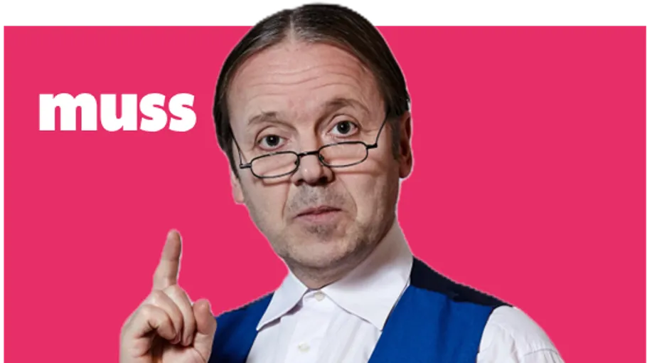 Man with glasses pointing against pink background.