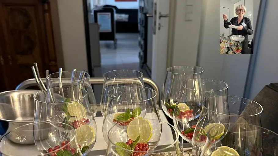 Glasses with lime, mint, pomegranate on cart.