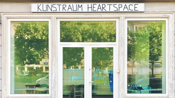 Art space entrance with large windows.