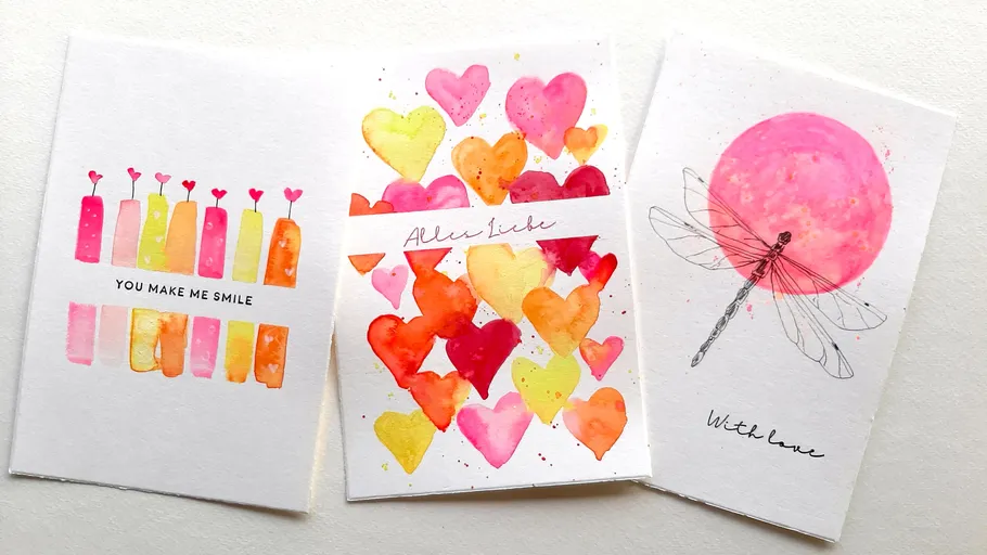 Three colorful greeting cards with heart designs.