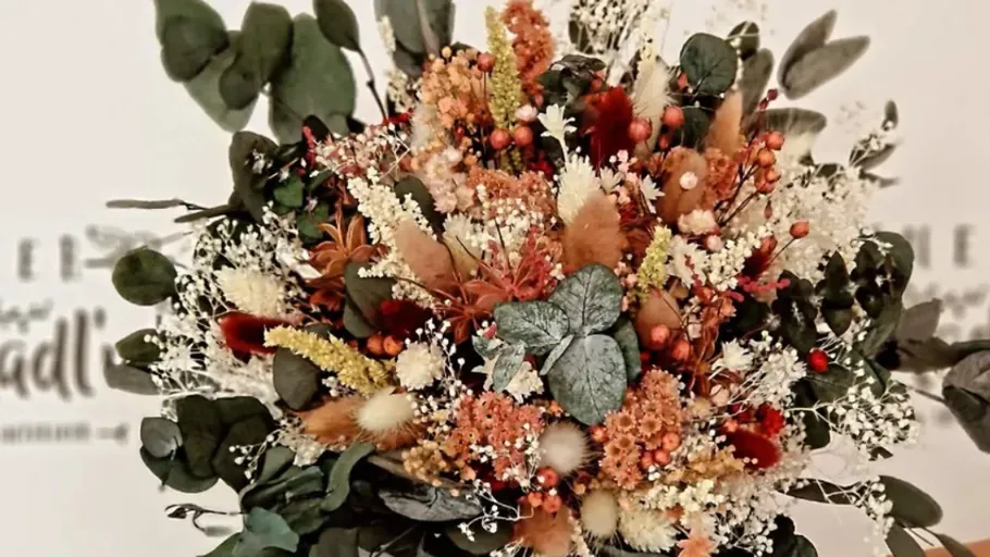 Dried floral bouquet with various colorful plants.