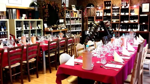 Dining tables set in a wine shop.