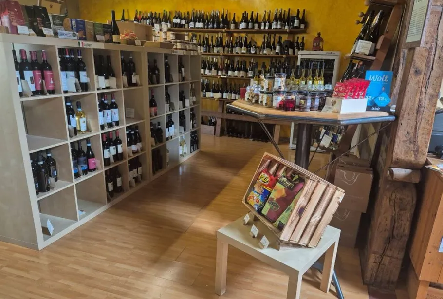 Shelves with wine bottles in a store.