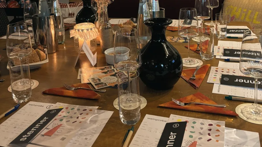 Table set for wine tasting event.