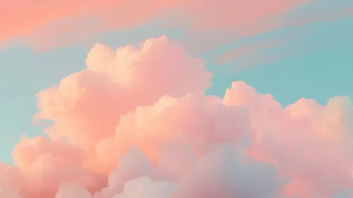 Rosafarbene Wolken im blauen Himmel bei Sonnenuntergang.