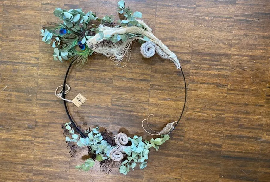 Decorative wreath on wooden floor.