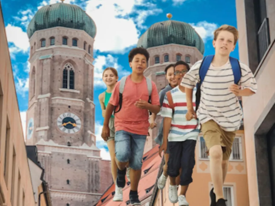 Children running in front of towers, city background.